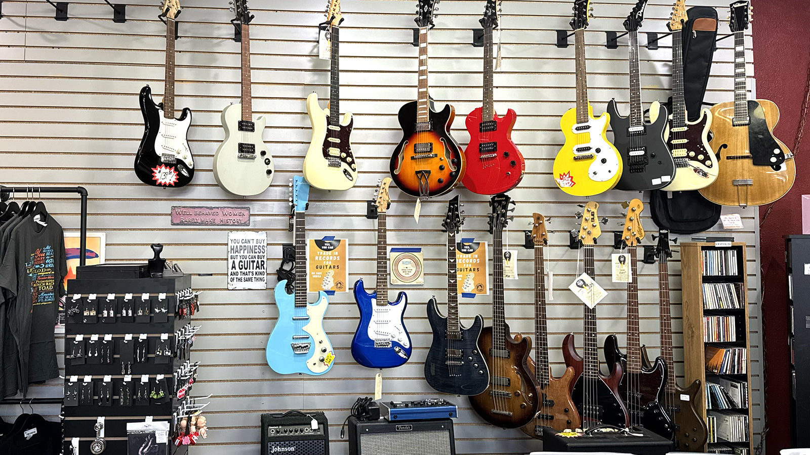 Display of various electric guitars and amps on a wall at Rockin' Ruby's Records in Poulsbo, WA