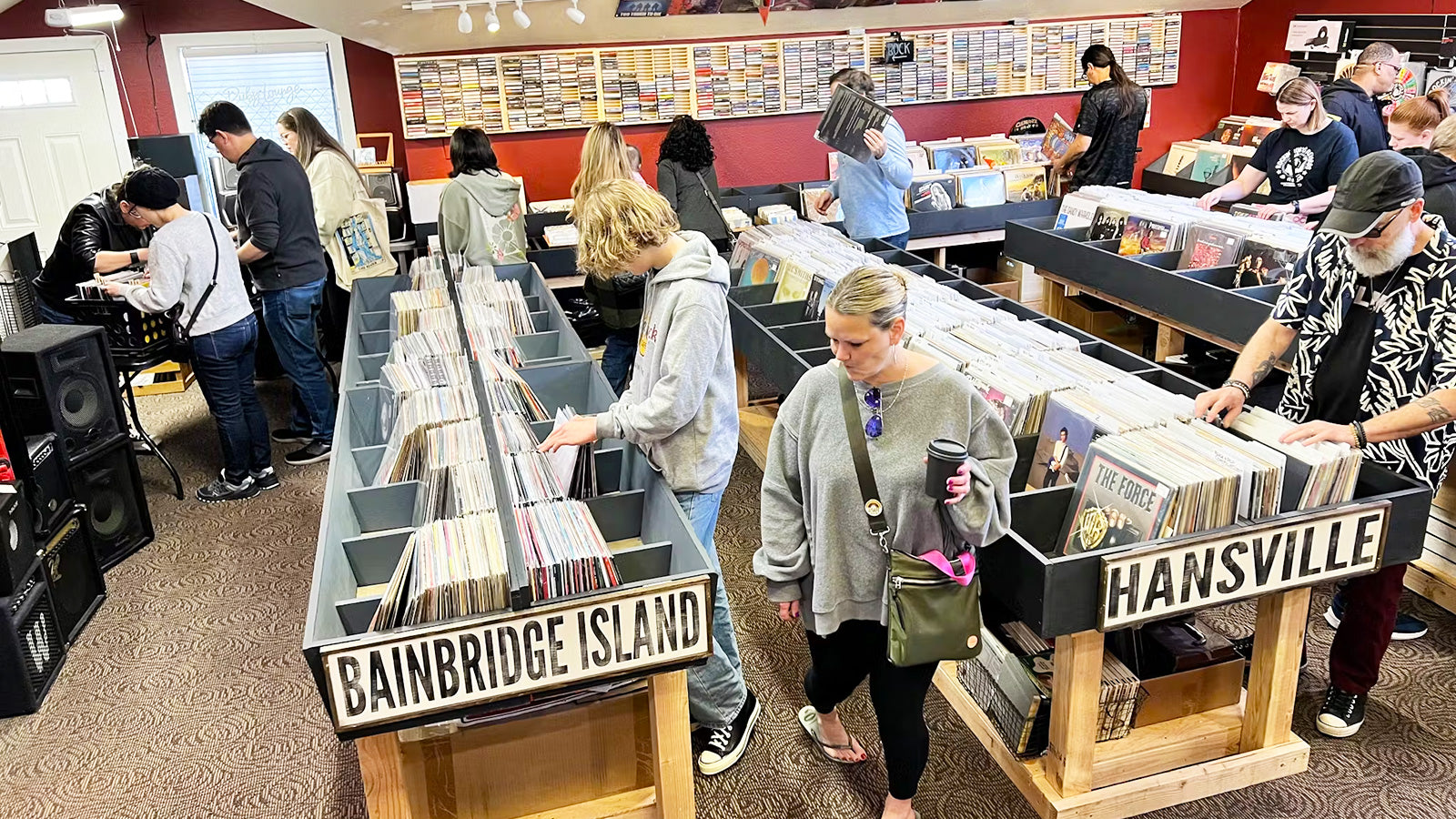 People browsing vinyl at independent record store Rockin' Ruby's Records in Poulsbo, WA