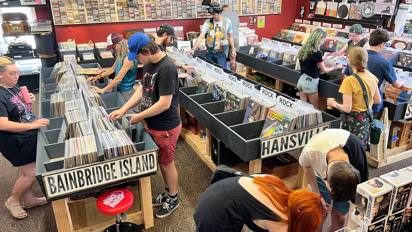 Music fans browsing vinyl bins at Rockin' Ruby's Records in Poulsbo, WA